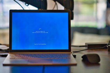 A loader for updates shown on a laptop
