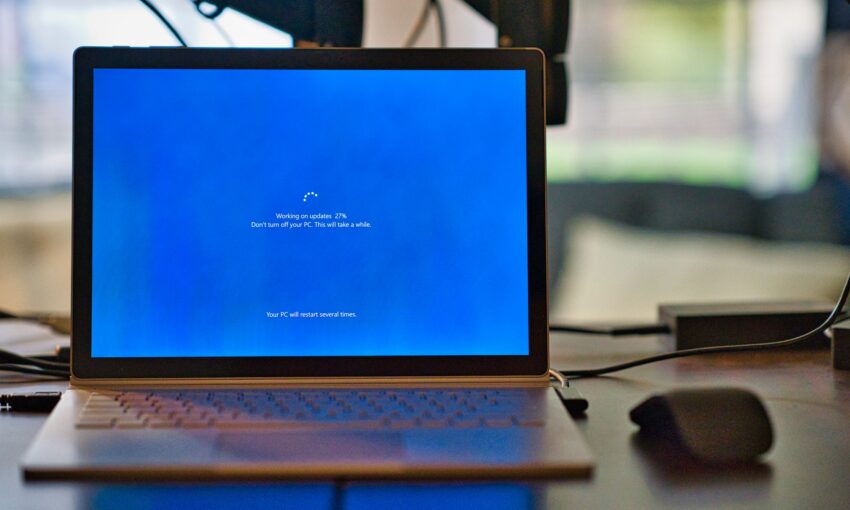 A loader for updates shown on a laptop