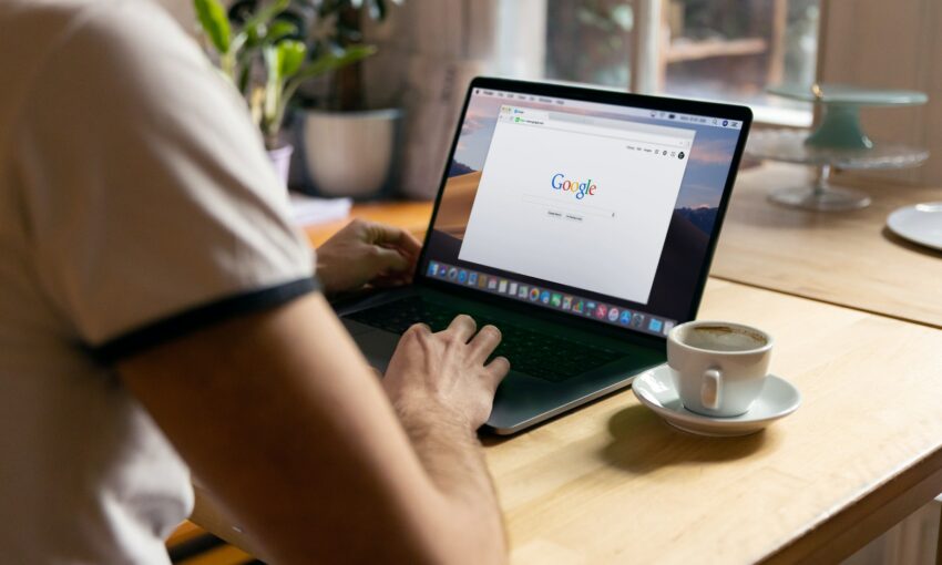 a person working on a lap top with Chrome open