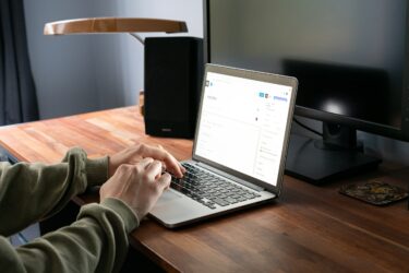 A person writing a new post in WordPress on a laptop
